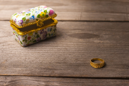 Surprise jewellery box, closed, on a wooden tableの写真素材