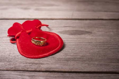 Dating ring on a wooden tableの写真素材