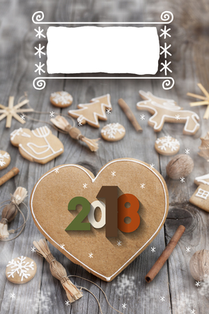 Christmas heart shaped gingerbread background. 2018 Winter holidays atmosphere. Snoflakes. Hand drawn ribbon for copy.Perfect for greeting cards, flyers, etc.Space for copyの写真素材