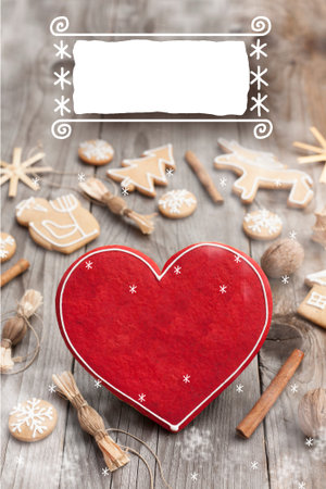 Christmas heart shaped gingerbread background. Winter holidays atmosphere. Snoflakes. Hand drawn ribbon for copy.Perfect for greeting cards, flyers, etc.Space for copyの写真素材
