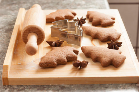 christmas gingerbread cookies baking process , dough and rolling pin,shallow depth of field.の写真素材