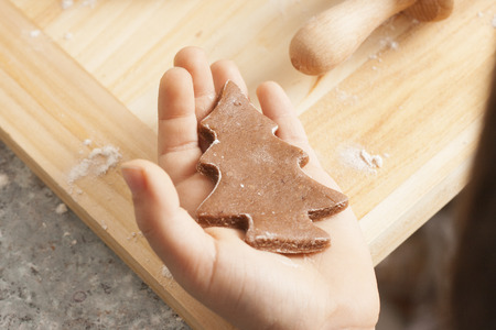christmas gingerbread cookies baking process , dough and rolling pin,shallow depth of field.の写真素材