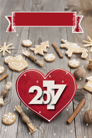 Christmas heart shaped gingerbread background. 2017 Winter holidays atmosphere. Snoflakes. Hand drawn ribbon for copy.Perfect for greeting cards, flyers, etc.Space for copyの写真素材