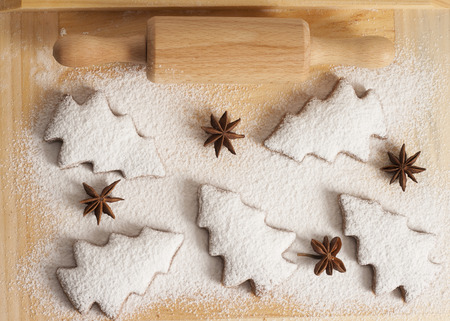 christmas gingerbread cookies baking process , dough and rolling pin,shallow depth of field.の写真素材