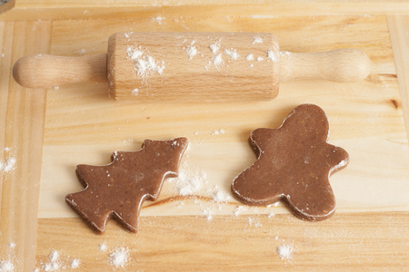 christmas gingerbread cookies baking process , dough and rolling pin,shallow depth of field.の写真素材