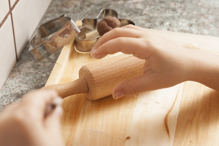 christmas gingerbread cookies baking process , dough and rolling pin,shallow depth of field.の写真素材