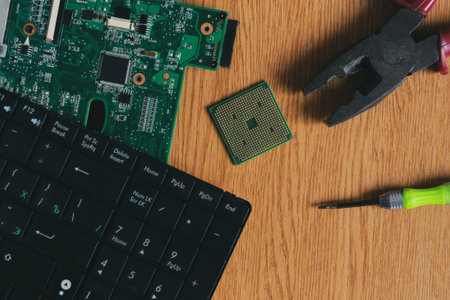 Computer service - repair a laptop or computer with a screwdriver and pliers