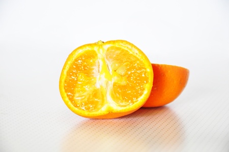 a nice juicy orange with a slicesの写真素材