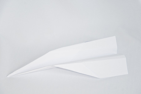 white paper Airplane on the white backgroundの写真素材