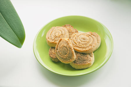 Delicious cookies on a green plateの写真素材