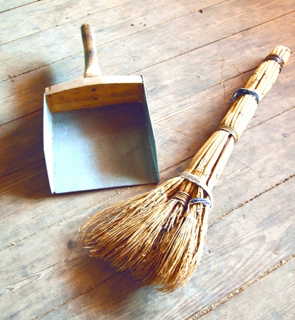 Scoop and broom on the floorの写真素材
