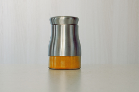 Spices in a special jar on the tableの写真素材