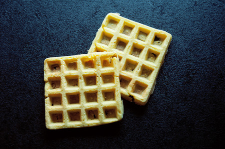 delicious waffle on a black table, top viewの写真素材