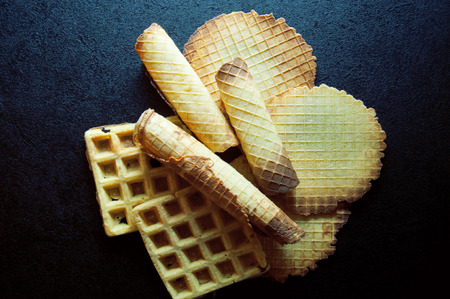 many delicious waffles on the black backgroundの写真素材