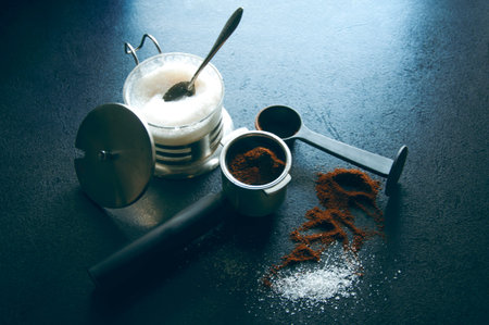 Ground coffee and sugar on a table