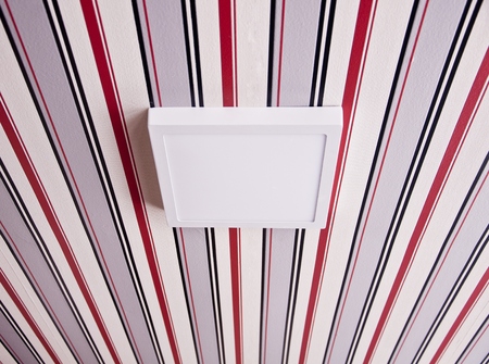 square luminaire (lamp) on the striped ceilingの写真素材