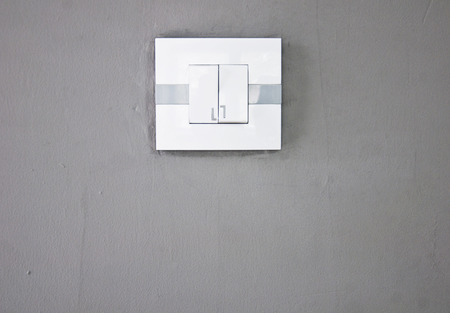 switch on a gray grunge wallの写真素材