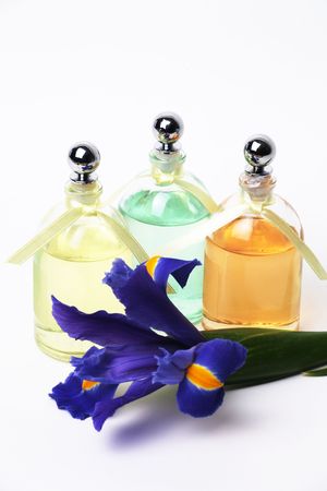 Essential Oils and Iris Flower on White Background.の写真素材