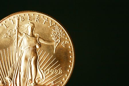 Golden Eagle American Coin On Black Backgroundの写真素材