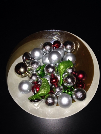 various colour Christmas ornaments in a decorative bowl の素材