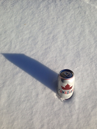 A can of Molson Canadian beer with a snowy background の素材