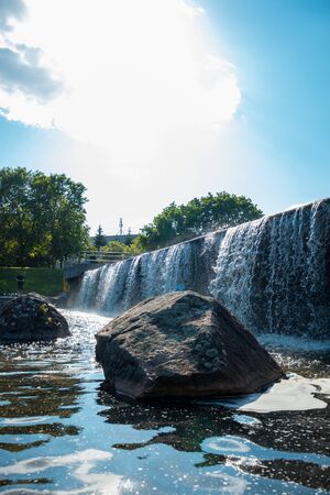 Waterfall with stones in the parkの写真素材