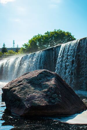 Waterfall with stone in the parkの写真素材