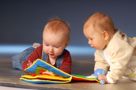 Babies playing with toysの写真素材