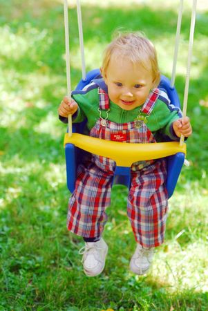 A girl on the swingの写真素材