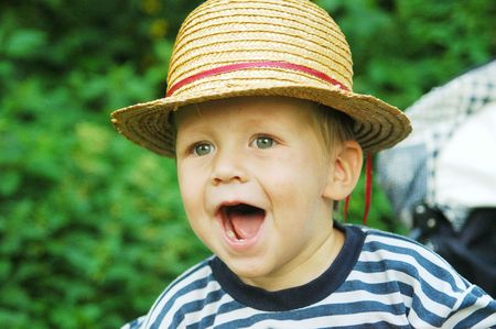 A little cheery boy with hatの写真素材