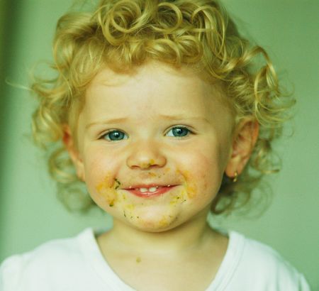 A smiling little blonde girlの写真素材