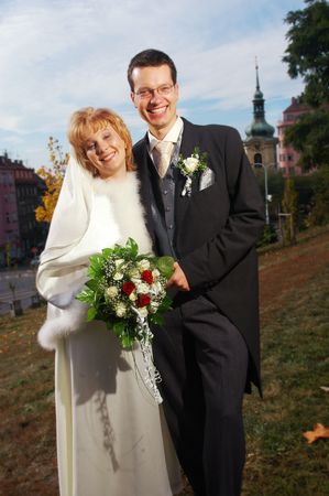 An young attractive and laughing newlywedsの写真素材