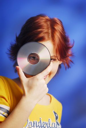 An young pretty girl holding a CDの写真素材