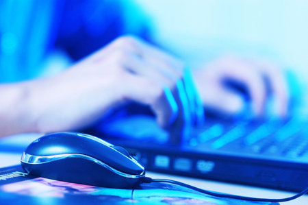 A man working on a computerの写真素材