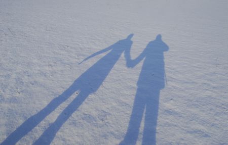 Silhouette of couple on the snowの写真素材