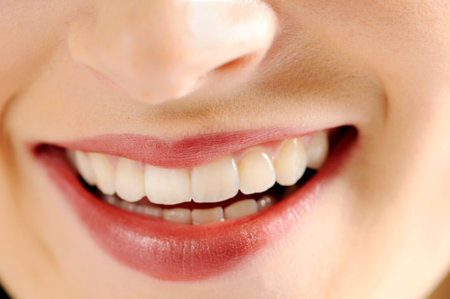 Lips of young attractive smiling woman