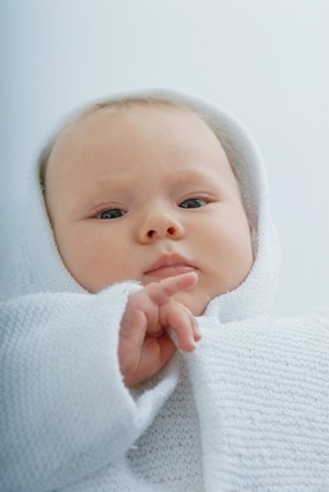 A baby in white hoodの写真素材