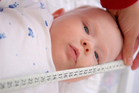Measuring of a small babyの写真素材