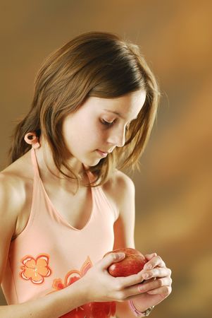 A girl with an appleの写真素材