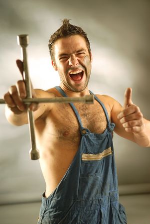 An auto-mechanic with a cross spanner.の写真素材