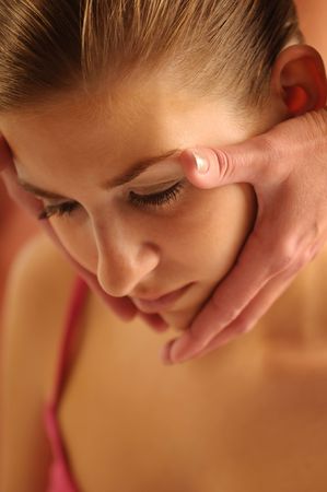 The attractive young woman during the massage of face.の写真素材