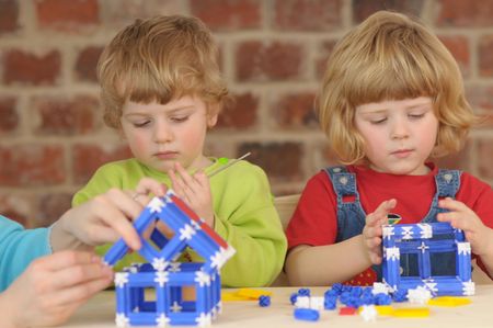 The children during the plaing with construction kit.の写真素材