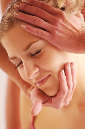 The attractive young woman during massage of face.の写真素材