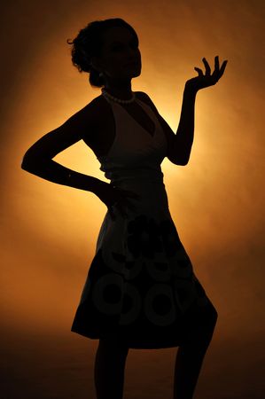 The young attractive woman in black and white dressの写真素材