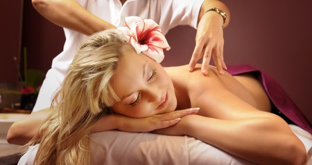 The attractive young woman with flower during the Thai massageの写真素材