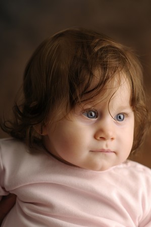 Little girl on brown background の写真素材