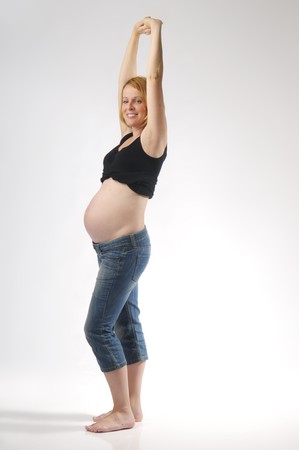 Beautiful pregnant woman on white backgroundの写真素材