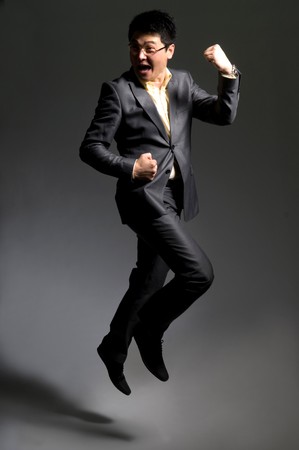 Jumping happy businessmanの写真素材