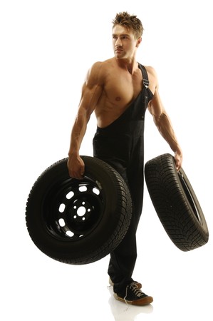 A man with a car tire の写真素材