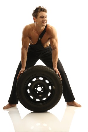 Man carries tiresの写真素材